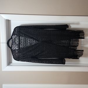 Women's long sleeve bathing suit cover up, with tie in the middle.